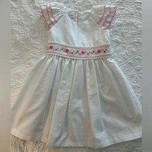 White dress with pink edged flutter sleeves